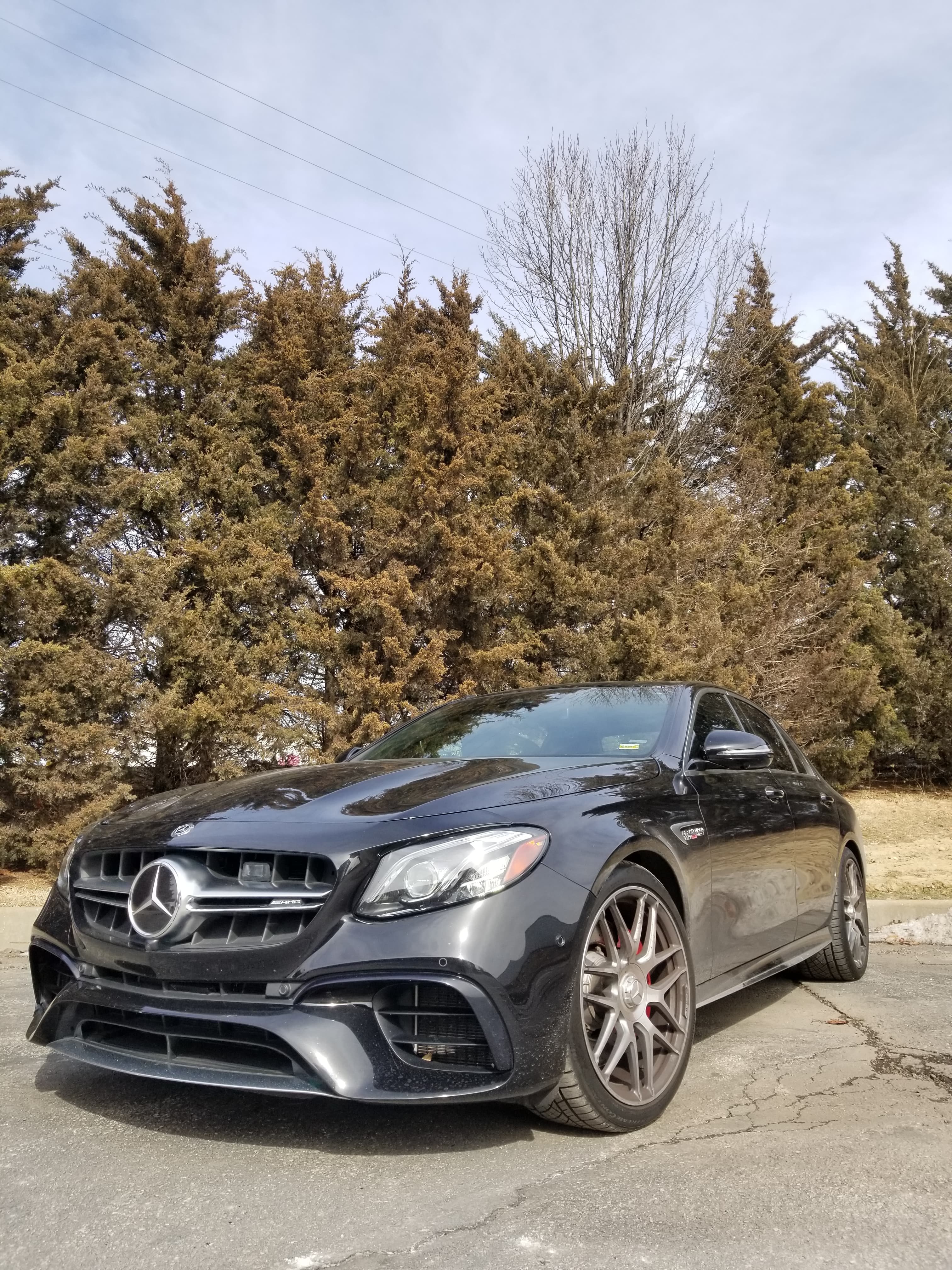 Black Mercedes-Benz AMG sedan parked outside ProVolume